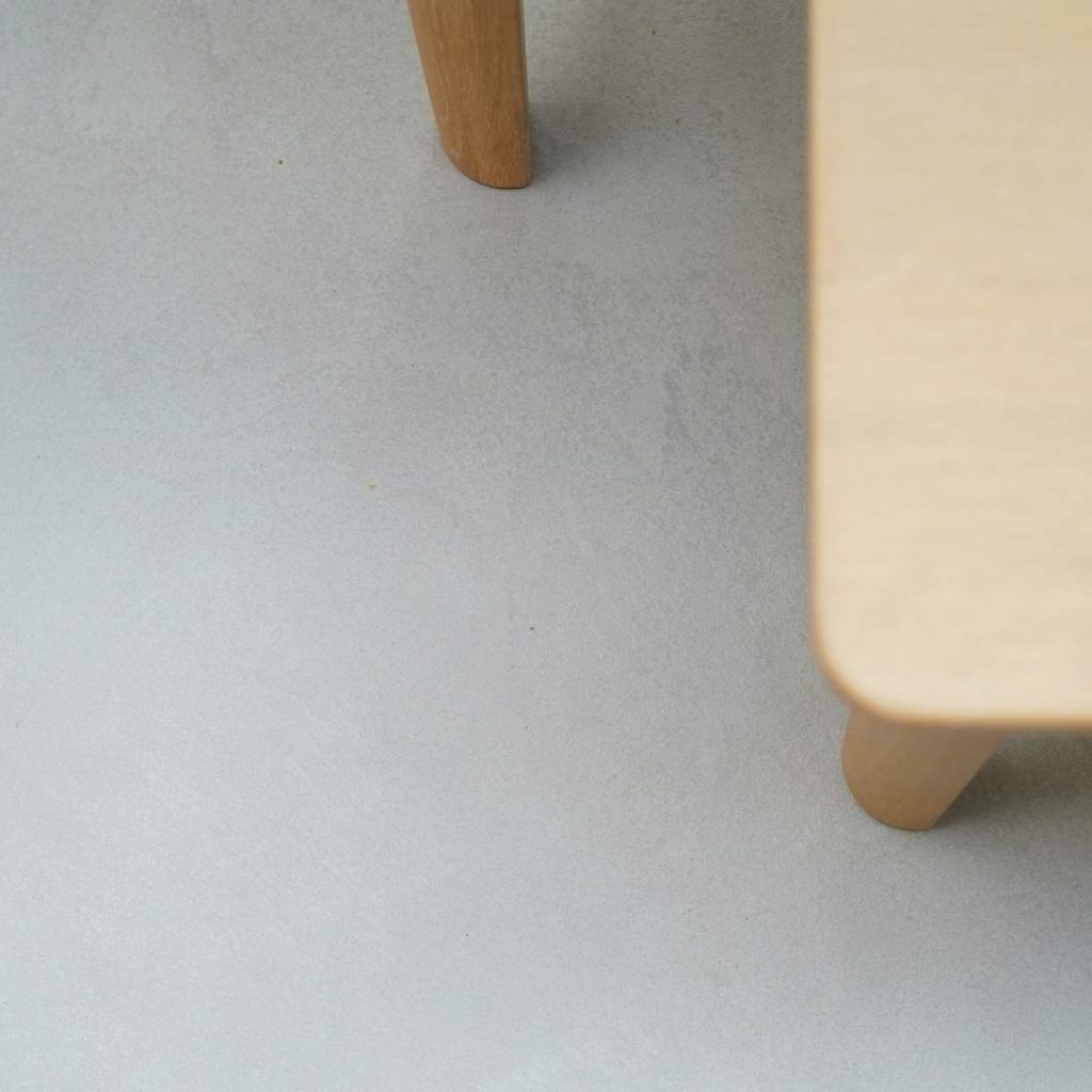 forcrete flooring with wood bench seating